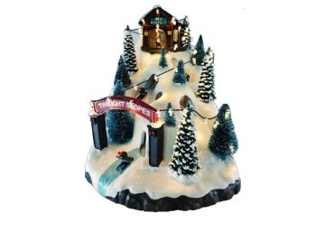 VILLAGGIO DI NATALE MUSICALE CON MONTAGNE INNEVATE 34.2X23 H. 25.5CM